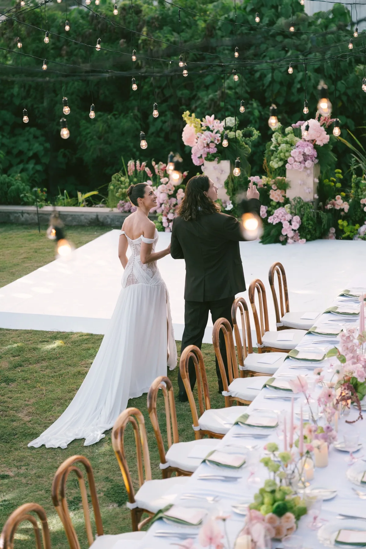 Golden hour at the reception, light falling soft across the table